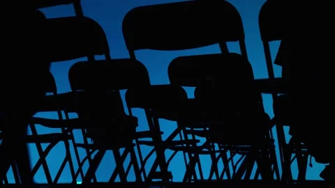 An abstract geometric pattern made of even rows of chairs. Silhouettes of chairs Stock Footage 194422437