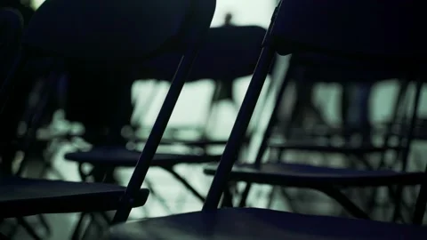 An abstract geometric pattern made of even rows of chairs. Silhouettes of chairs Stock Footage 194422473