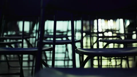 An abstract geometric pattern made of even rows of chairs. Silhouettes of chairs Stock Footage 202533869