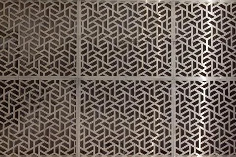 Abstract geometric pattern of metal panels with decorative cutouts and industry Stock Photos
