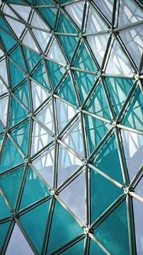 Abstract geometric pattern of a triangular blue glass ceiling. Stock Photos
