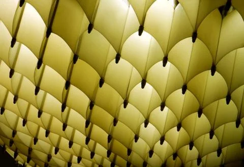 Abstract geometric regular luminous light yellow with dark shadows texture Foto stock
