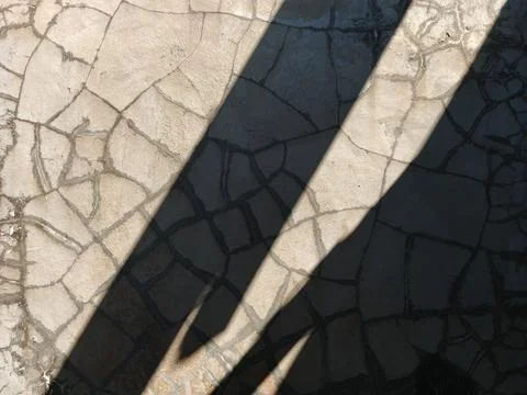 Abstract Geometric Shadow on Cracked Cement Wall Surface Stock Photos