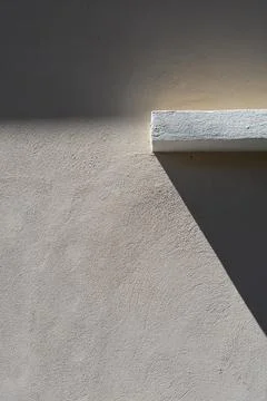 Abstract Geometric Shadow on Plaster Wall Stock Photos