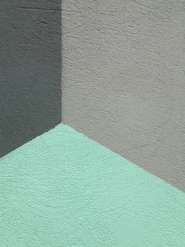 Abstract geometric wall corner painted in shades of mint green and gray Stock Photos