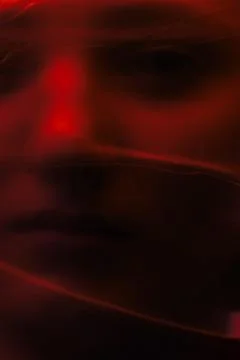 Abstract ghostly red face creating somber mood Stock Photos
