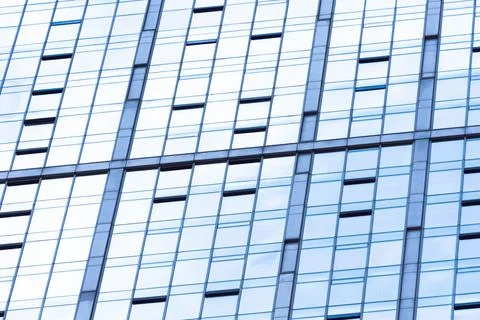 Abstract glass surface with geometric triangular shapes and dark inserts of o 库存照片