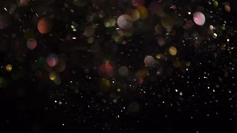 Abstract glittering particles floating bokeh. Colorful blurred dust sparkles Stock Footage 111061128