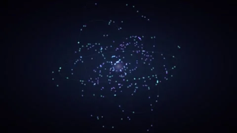 Abstract glowing atom with orbiting particles on dark background Stock Footage 335893888