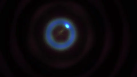 Abstract glowing blue circular lens flare light effect on dark background. Stock Footage 346328927