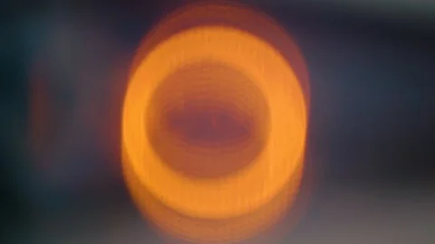 Abstract glowing circular orange light glows fades &amp; pulses on screen Stock Footage 113293316