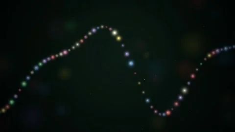 Abstract glowing colorful particles forming a flowing wave line on a dark Video stock 345430071