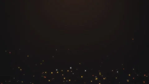 Abstract glowing fire ember sparks flying upward against dark background ci.. Видео 341285547