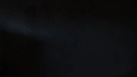 Abstract glowing flying chaotically dust snowflakes on a dark background Stock Footage 144375282