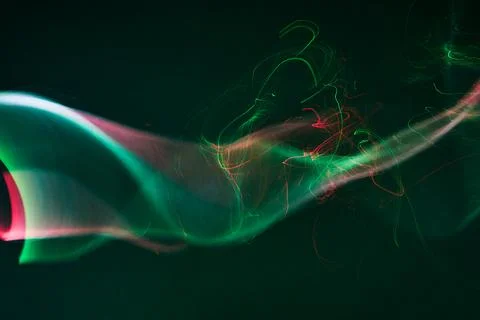 Abstract glowing light trails creating dynamic wavy lines Stock Photos