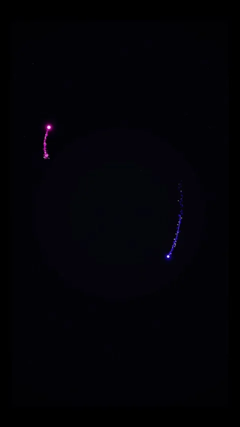 Abstract Glowing Neon Particle Trails Orbiting in Dark Space Video stock 334760916