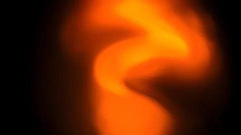 Abstract glowing orange light swirl on a solid black background Stock Illustration