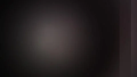 Abstract Glowing Orb Pulse in Dark Ambient Background with Subtle Light Fla.. Stock Footage 340940569