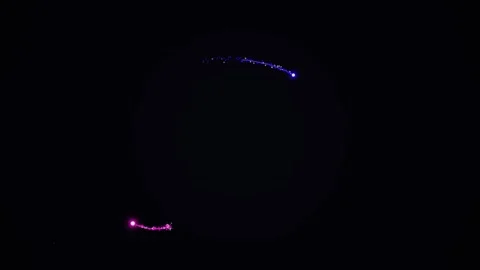 Abstract Glowing Particle Trails Circular Motion on Black Background Vídeo Stock 334761078