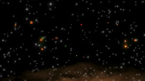 Abstract glowing particles floating through dark space with soft amber haze at 스톡 동영상 345330532