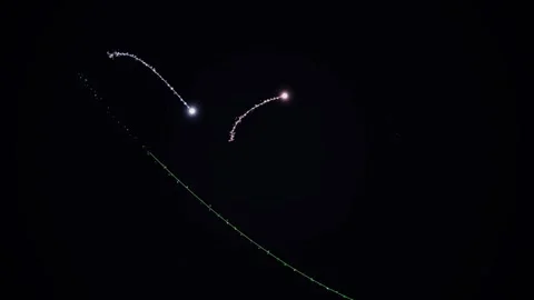 Abstract Glowing Particles with Glittering Trails in Dark Space Stock-Footage 335023376