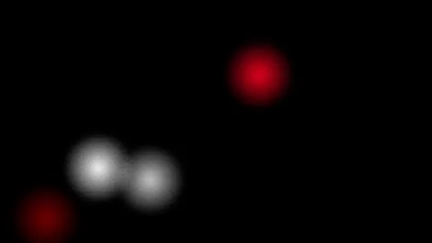 Abstract glowing particles moving slowly in dark background with shallow de.. Stock Footage 340943725