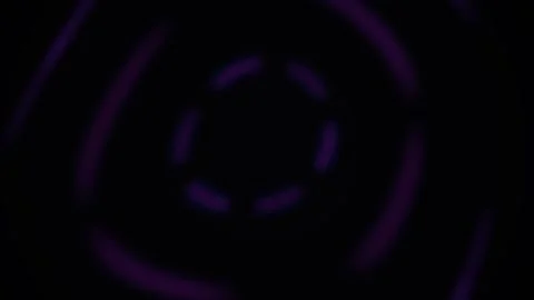 Abstract glowing purple neon light rings spinning on black background. Stock Footage 346338646