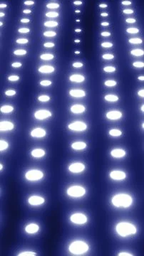 Abstract glowing rows of bright white dots fading into a dark background Stock Photos