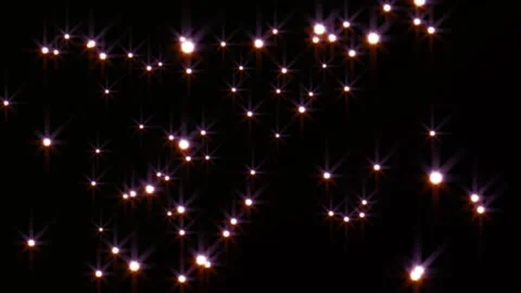 Abstract glowing star particles floating slowly across dark background with Stock Footage 345331287