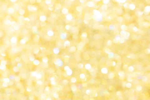 Abstract glowing yellow background, texture, glitter vintage glare, bokeh 库存照片