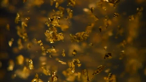 Abstract Gold background. Luxury transparent cream gel with sparkling 24k gold Vidéo 334043309