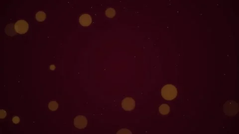 Abstract gold bokeh particles floating on dark maroon background create ele.. Video stock 342153476
