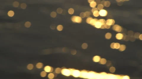 Abstract Gold Bokeh Reflections on the Water Surface Video stock 63998194