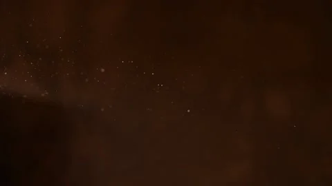 Abstract gold glowing flying chaotically dust snowflakes on a dark background Stock Footage 144362066