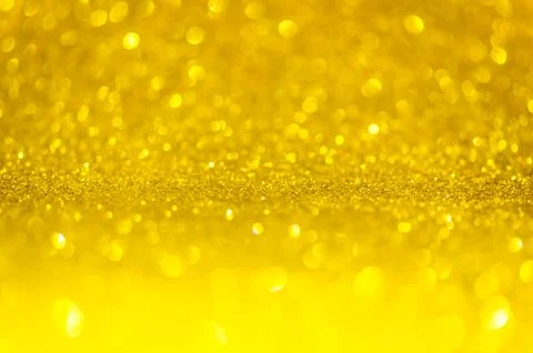 Abstract gold texture glitter lights background. de-focused. Stock Photos