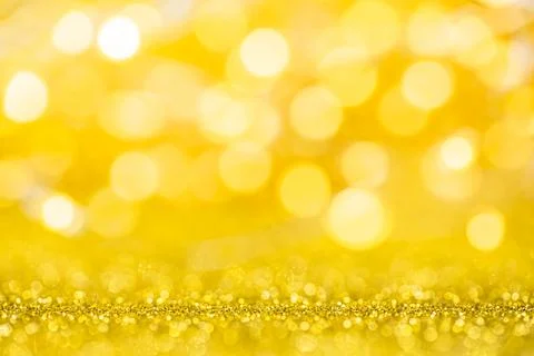 Abstract gold texture glitter lights background. de-focused. Stock Photos