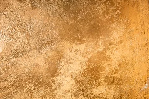 Abstract Gold Texture. Wall Colored With Golden Plaster. Stock Photos