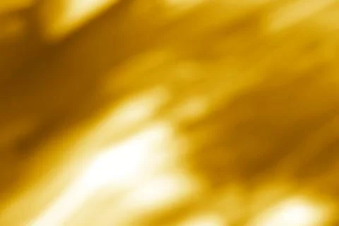 Abstract golden backdrop with blurred highlights and subtle movement Stock Photos