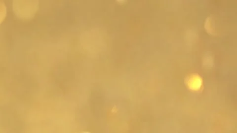 Abstract golden background, motion blurred golden lights, bokeh effect. Stock Footage 297369739