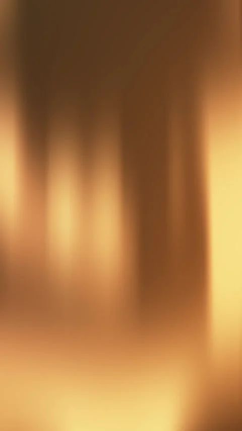 Abstract golden blurred background with soft flowing light, warm tones Stock Footage 293370498
