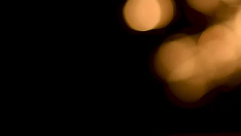 Abstract golden bokeh bubbles moving smoothly on black background Stock Footage 345960651