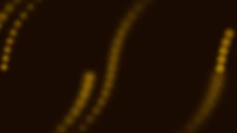 Abstract golden bokeh light dots forming soft curved lines on dark background 库存影片 336262519
