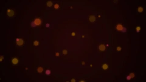 Abstract golden bokeh lights floating against a deep dark background Video stock 338310734