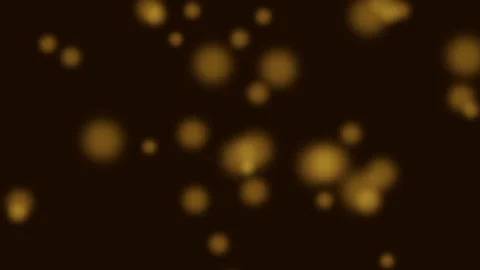 Abstract golden bokeh particles floating against a deep dark background Stock Footage 335146049