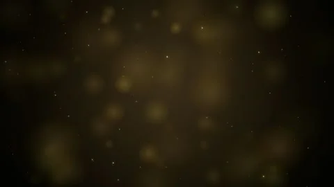 Abstract Golden Bokeh Particles Floating Slowly on a Dark Brown Background for Video stock 345430140