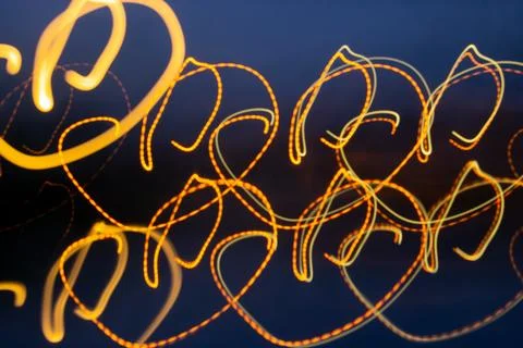 Abstract golden light circle effect. Neon thin hearts, light abstractions, .. Stock Photos