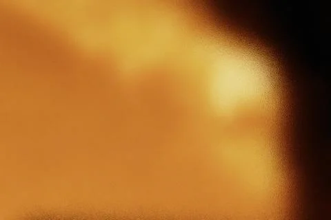 Abstract golden light creating a textured warm background Stock Photos