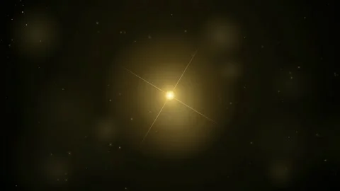Abstract Golden Light Flare Pulsing and Sparkling Against a Dark Space Stock Footage 346217482
