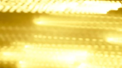 Abstract golden light patterns with blurred motion effects in background Stock Photos