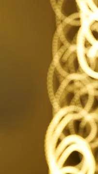 Abstract golden light patterns with blurred circular shapes and soft backgrou Stock Photos